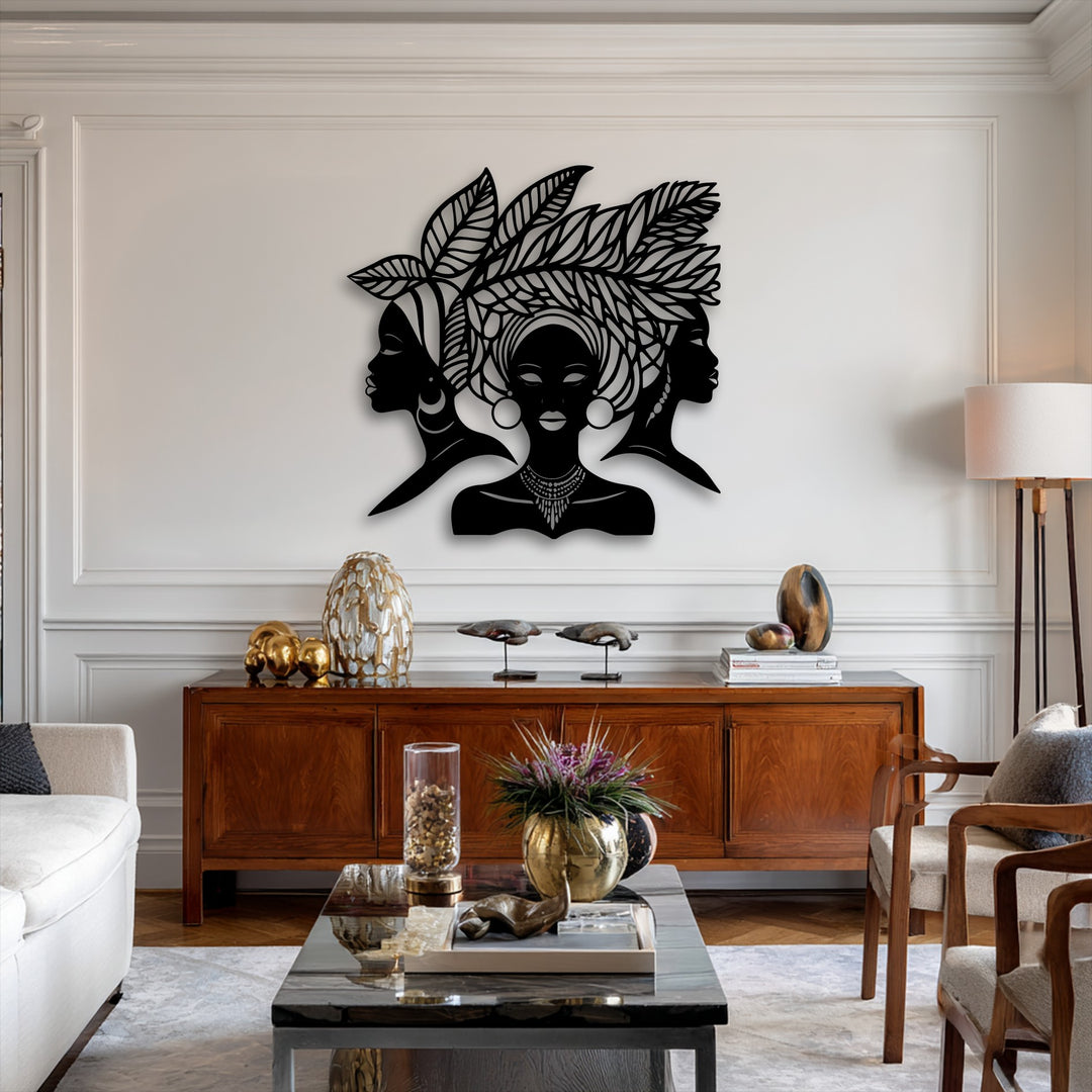 Multiple visual layers are evident with the bold African Queen Silhouette metal wall decor prominently mounted above a rich wooden console.