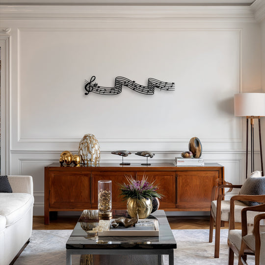 The sleek black decorative metal art featuring flowing musical notes creates a stark contrast against the pristine white wall.