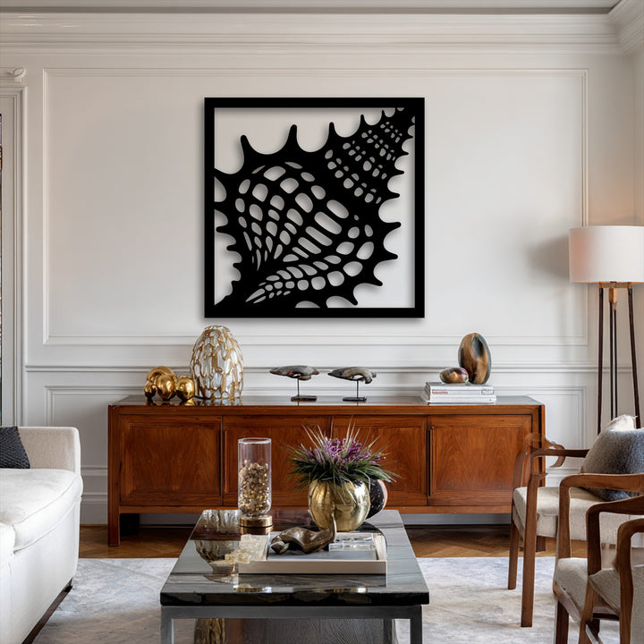 The abstract quality of the decorative metal art showcases an intricate, stylized seashell frame with an organic ocean texture.