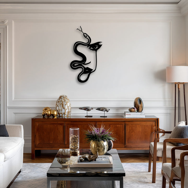 Dramatic light and shadow highlight the striking abstract woman and serpent decorative metal art, forming a captivating silhouette on the pristine wall.