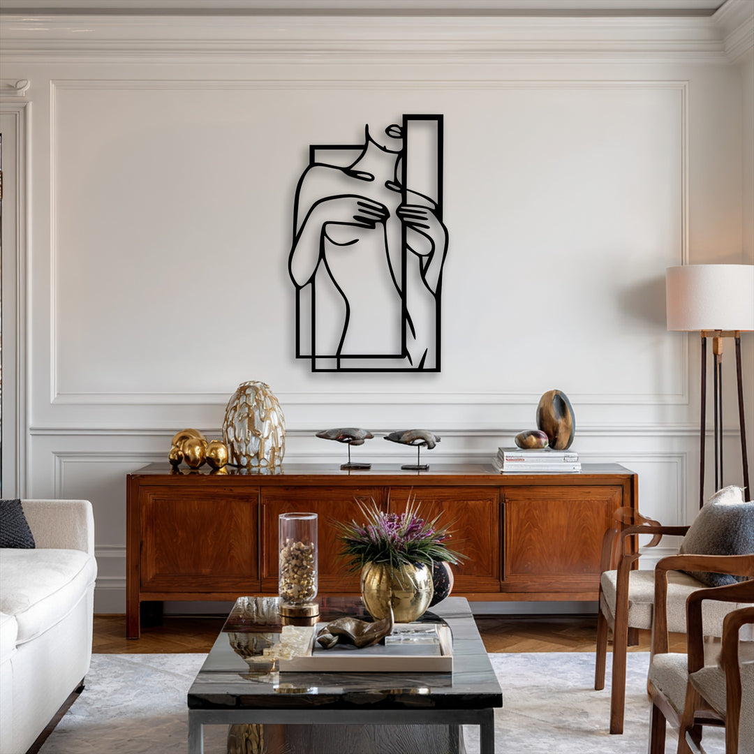 The flowing lines of the minimalist female figure line art create a subtle sense of graceful movement within this modern decorative metal art.