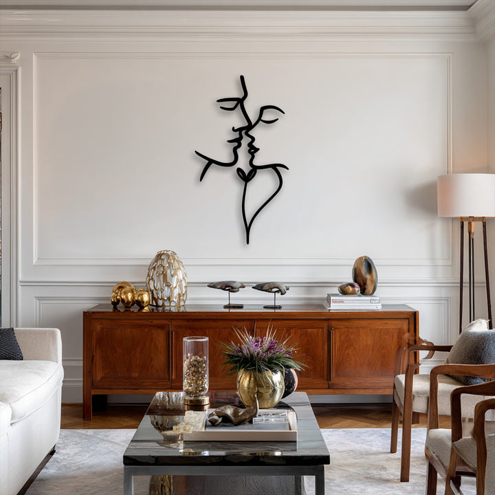 Vertically oriented abstract face metal artwork depicts two intertwined profiles forming a stylized heart shape, ideal for modern interiors.