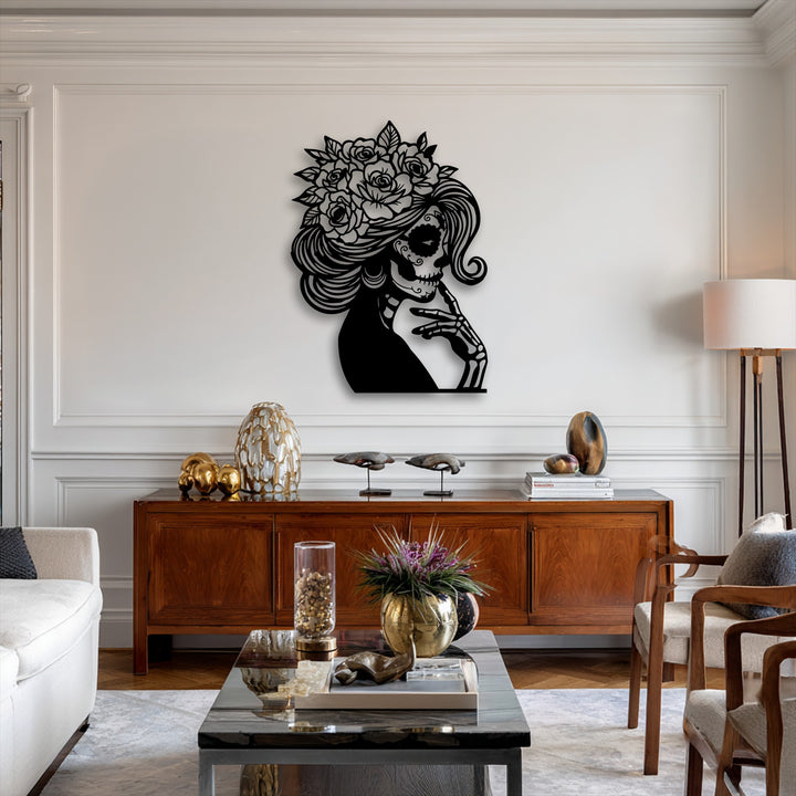 Organic forms define this striking Floral Sugar Skull Lady metal wall decor, featuring flowing hair, roses, and a contemplative skeletal hand.