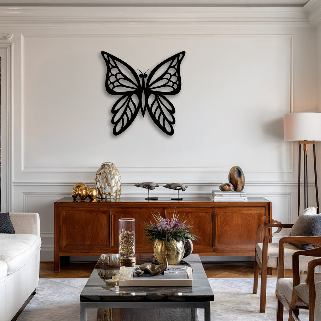 The prominent color contrast of the black decorative metal art butterfly on the bright white wall accentuates this elegant metal wall art.