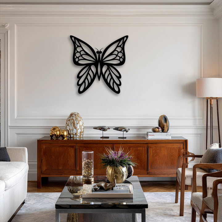 The prominent color contrast of the black decorative metal art butterfly on the bright white wall accentuates this elegant metal wall art.