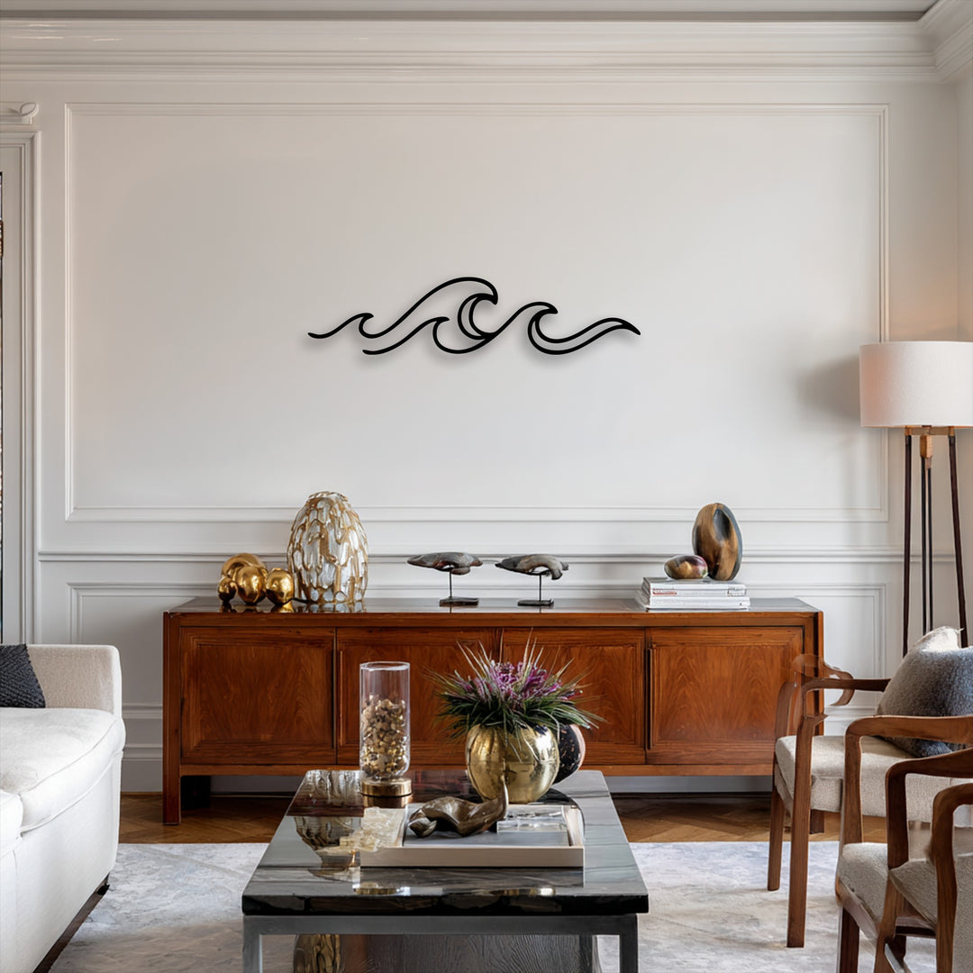 The sleek, dark silhouette of minimalist ocean wave line metal decoration wall art stands out against a light wall above a rich wooden console.