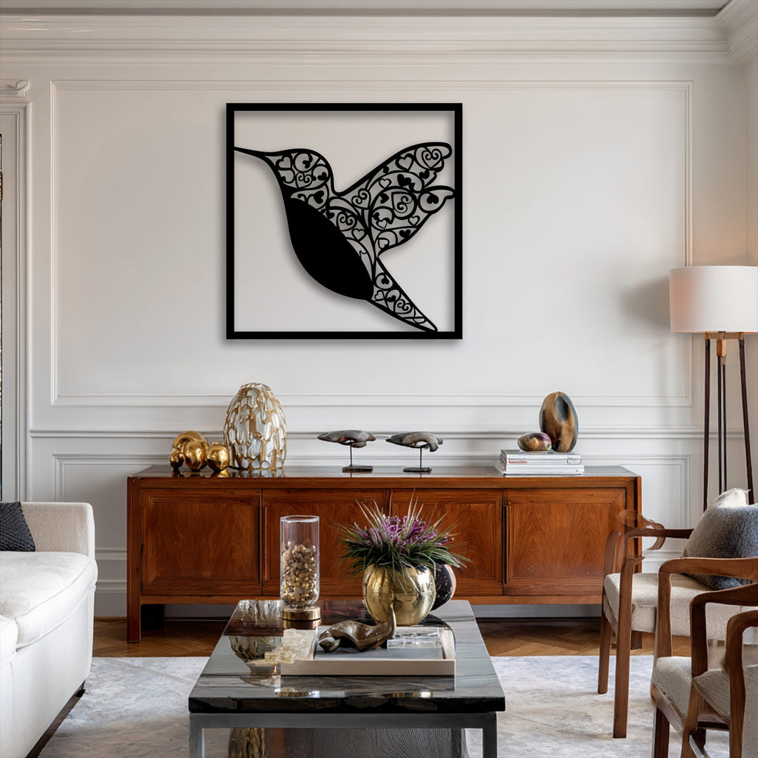 A beautiful metal art for wall featuring a hummingbird silhouette crafted with intricate organic heart and swirl patterns.