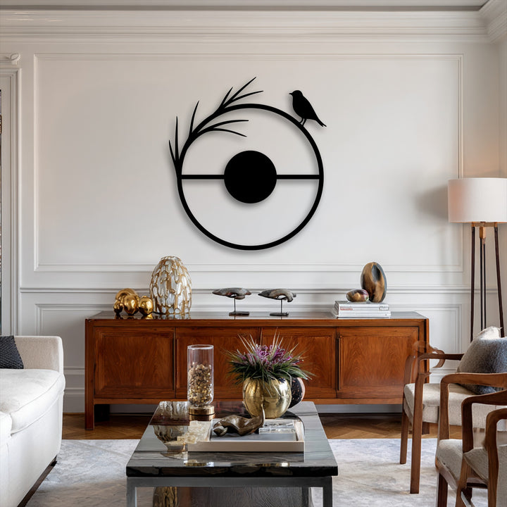 The invitingly warm color temperature of the room complements the striking minimal bird circle metal artwork, creating a cozy ambiance.