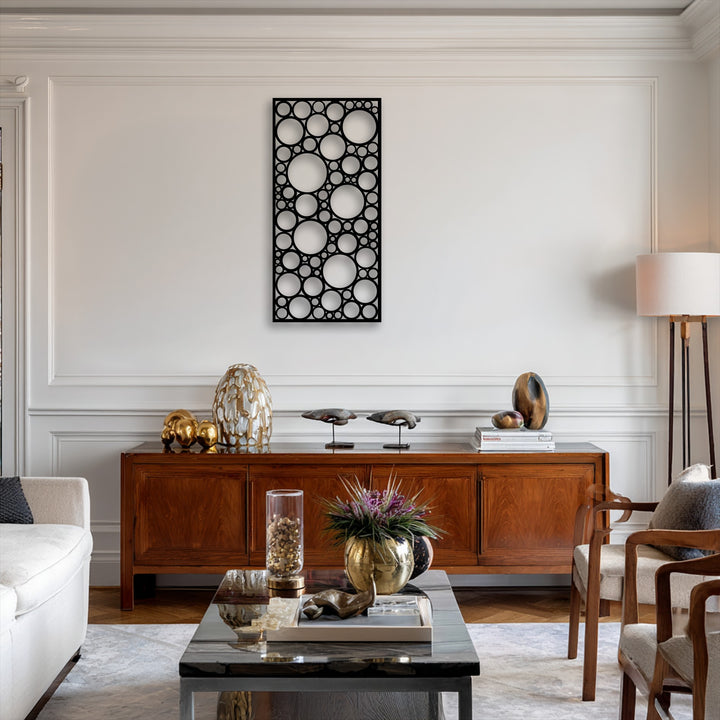 A vertically oriented rectangular metal art for wall panel features a modern abstract design of interconnected geometric circles.