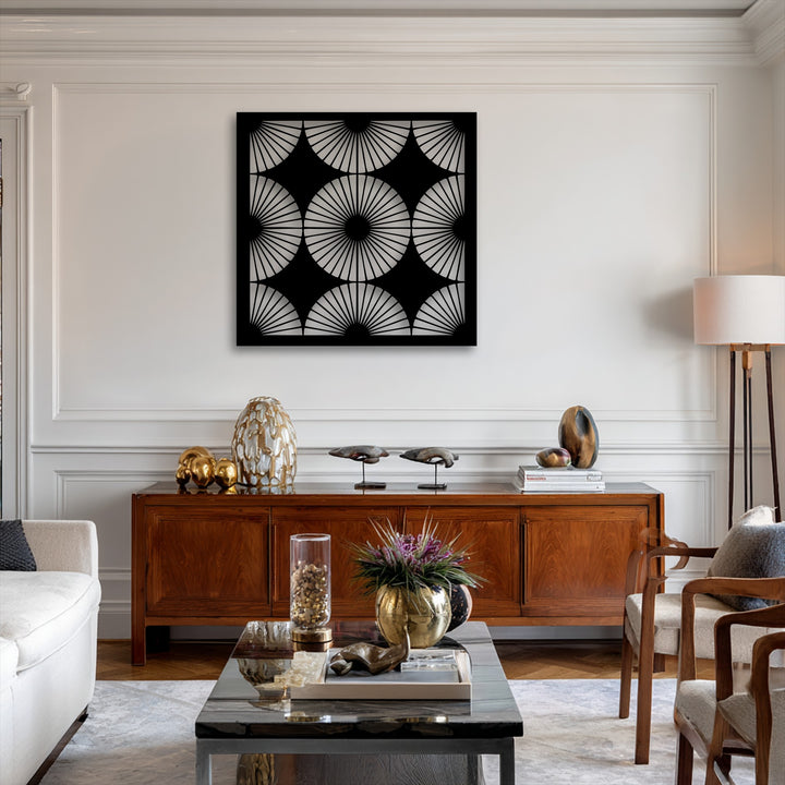 The negative space of the black geometric radiant fan pattern metal artwork reveals the pristine wall, highlighting its modern symmetry.