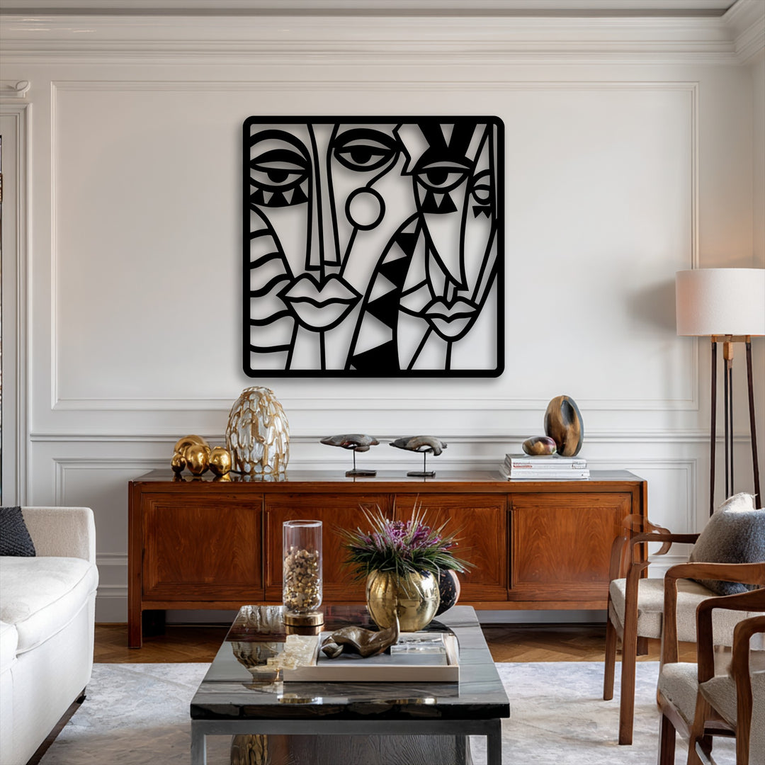 A pristine white wall forms the brightest area, showcasing a striking abstract faces metal wall decor with cubist lines.