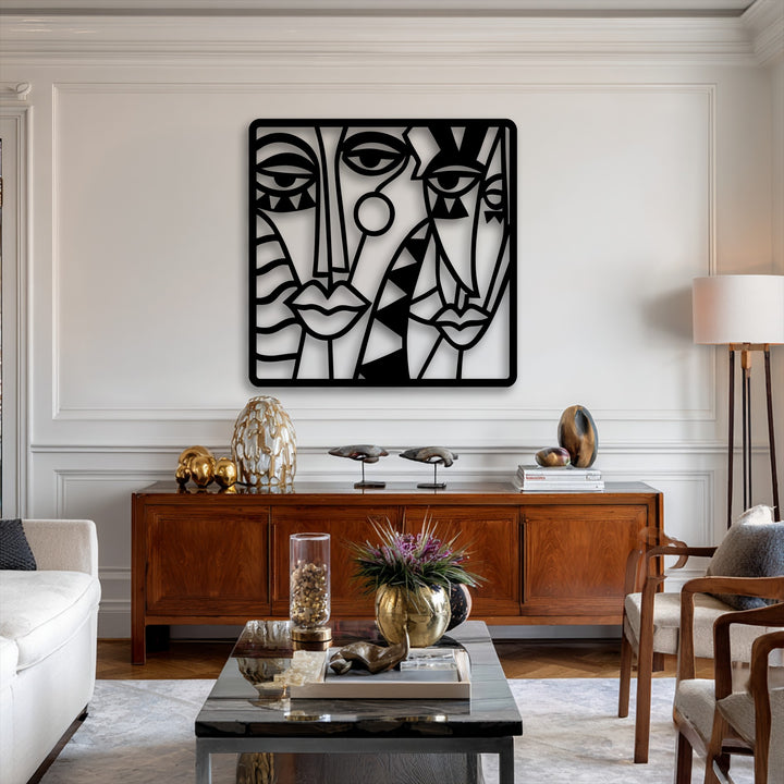A pristine white wall forms the brightest area, showcasing a striking abstract faces metal wall decor with cubist lines.