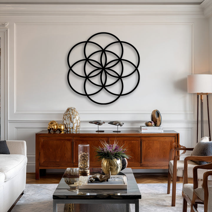 The matte black finish of the Flower of Life geometric decorative metal art offers a sleek and modern sacred balance.