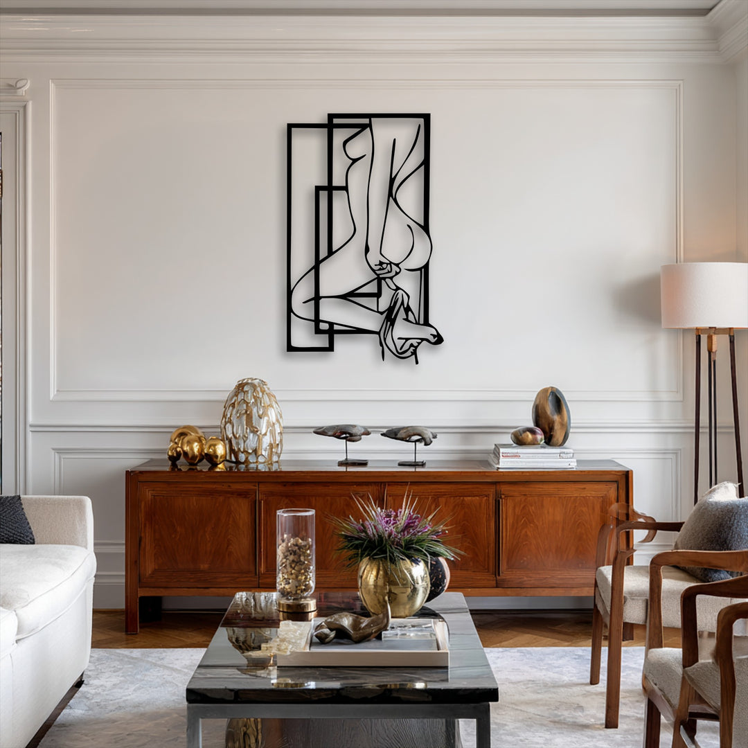 The unique metal wall art featuring an abstract feminine silhouette and geometric frames establishes a compelling visual rhythm on the white wall.