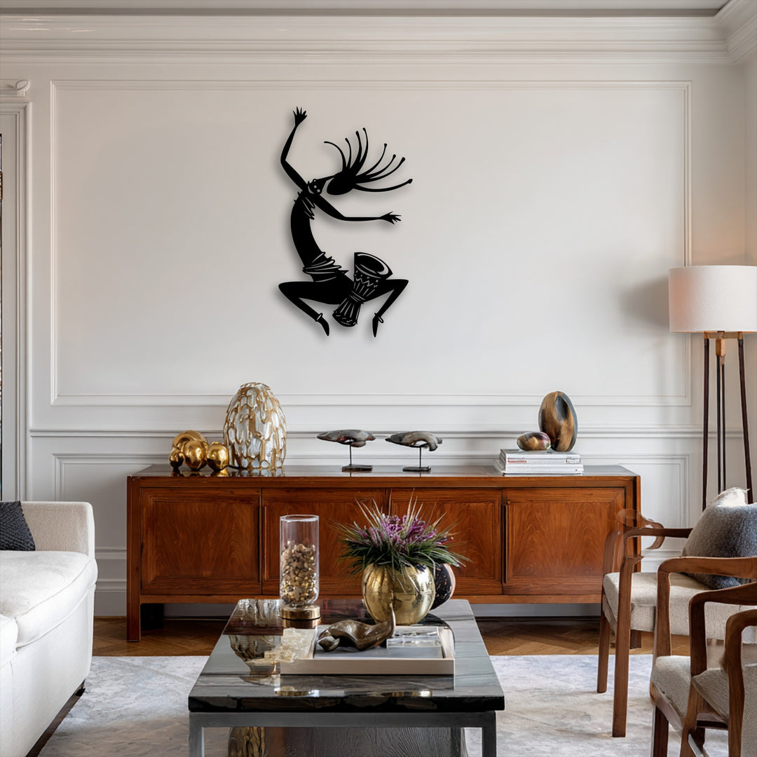 The finish of this unique metal wall art showcases a striking, deep black silhouette, adding energetic tribal dance decor.