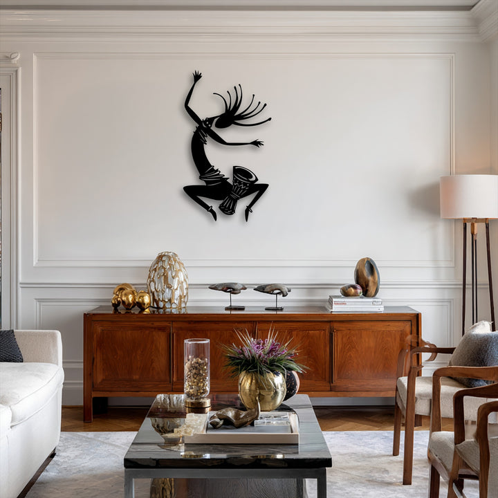 The finish of this unique metal wall art showcases a striking, deep black silhouette, adding energetic tribal dance decor.