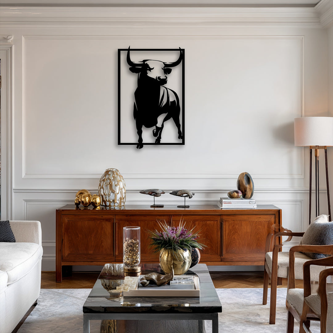 A soft, warm color temperature illuminates the striking powerful bull metal artwork, complementing the rich wooden furniture.