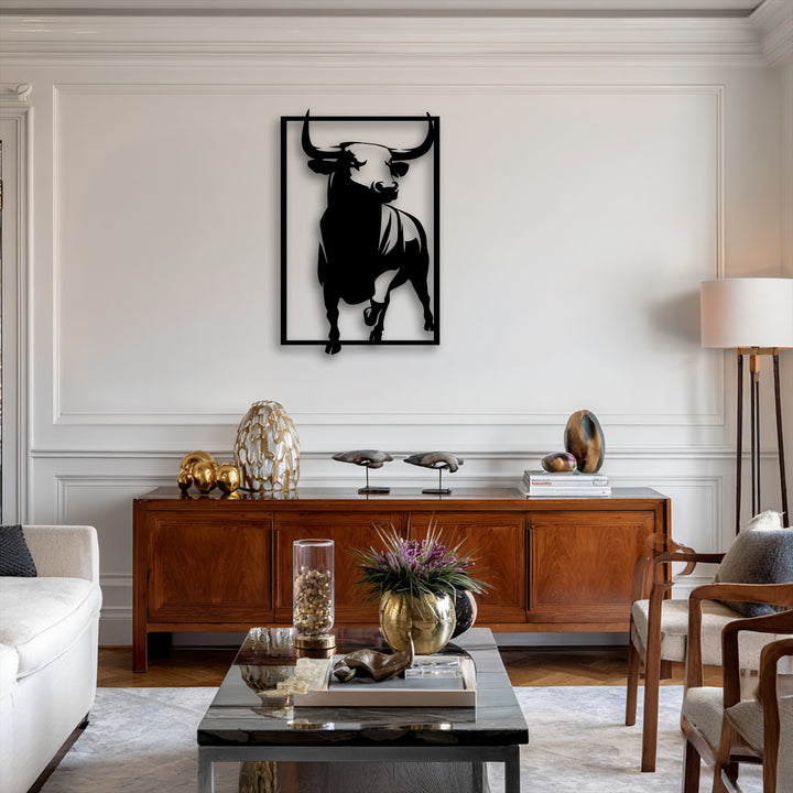 A soft, warm color temperature illuminates the striking powerful bull metal artwork, complementing the rich wooden furniture.