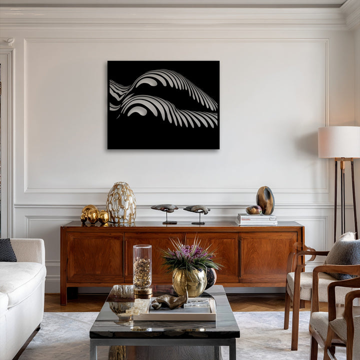 A warm color temperature pervades the scene, contrasting with the cool, monochrome unique metal wall art's abstract wave design.
