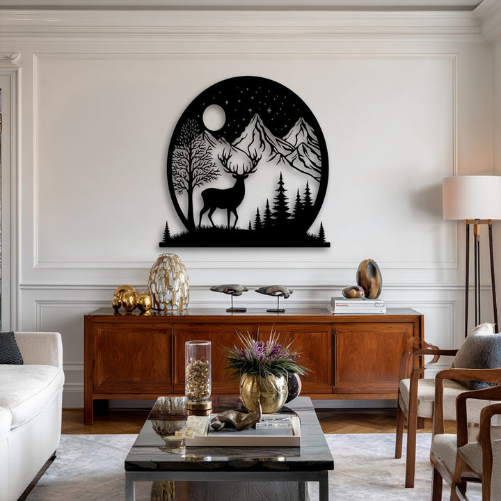 The smooth, non-reflective surface texture of the unique metal wall art presents a bold silhouette of a deer in a moonlit mountain scene.