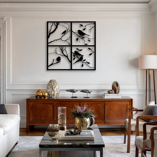 The striking color contrast of the black four panel bird silhouette metal wall decor against the light wall creates a sophisticated focal point.