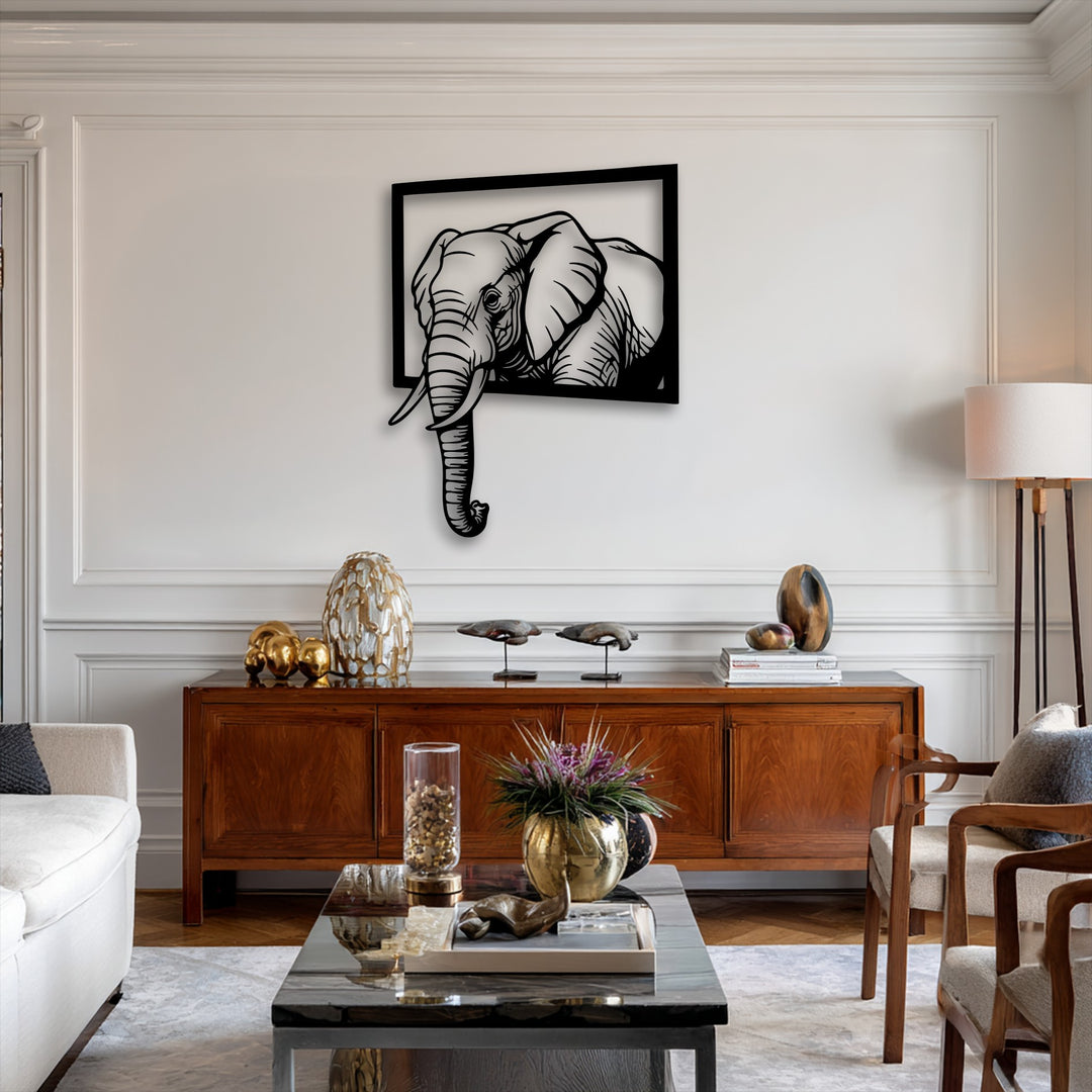 The smooth, matte black surface texture of the Emerging Elephant Frame metal art for wall creates a crisp, striking 3D effect.