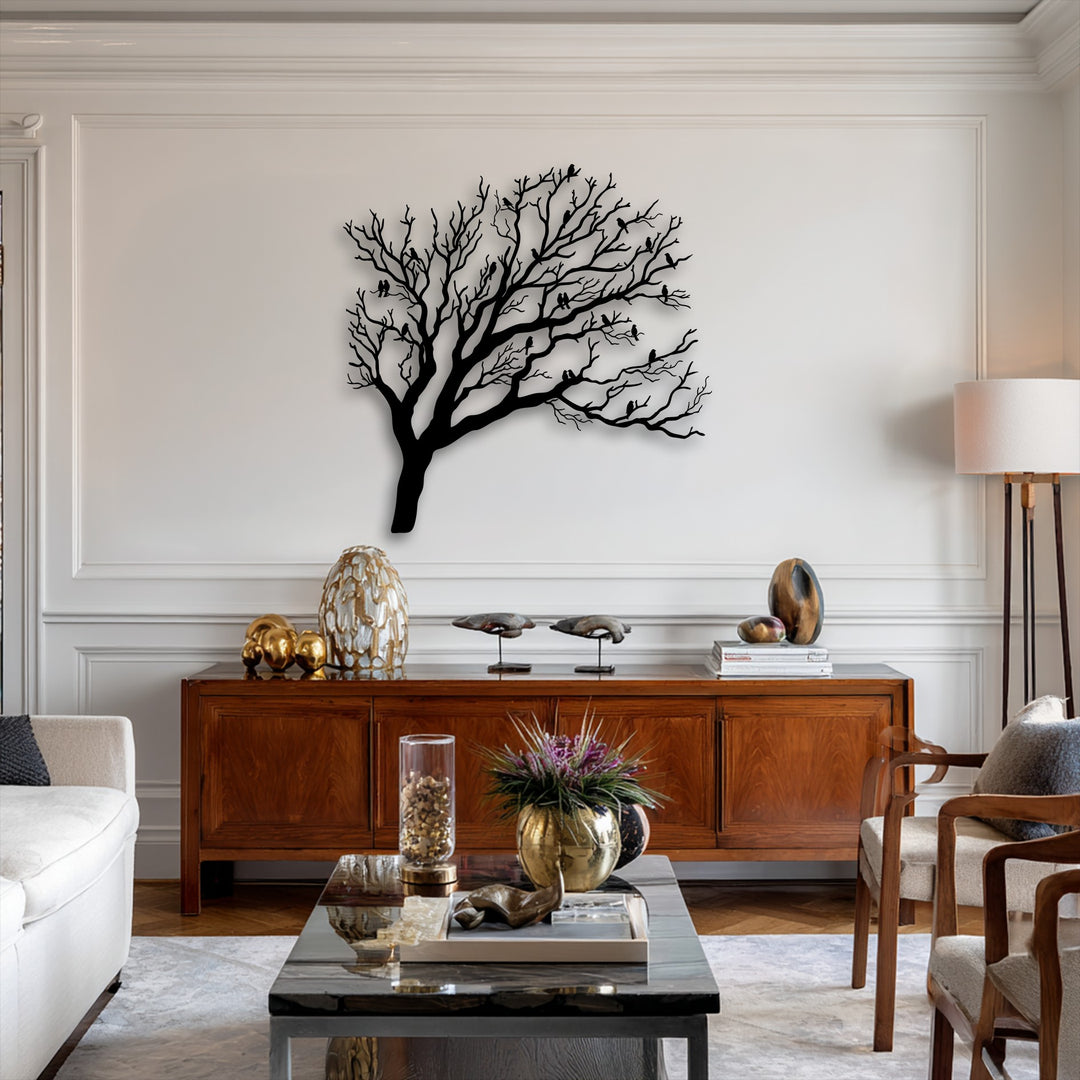 Horizontally oriented, organically shaped metal wall decor featuring a sprawling tree silhouette with numerous birds perched on its bare branches.