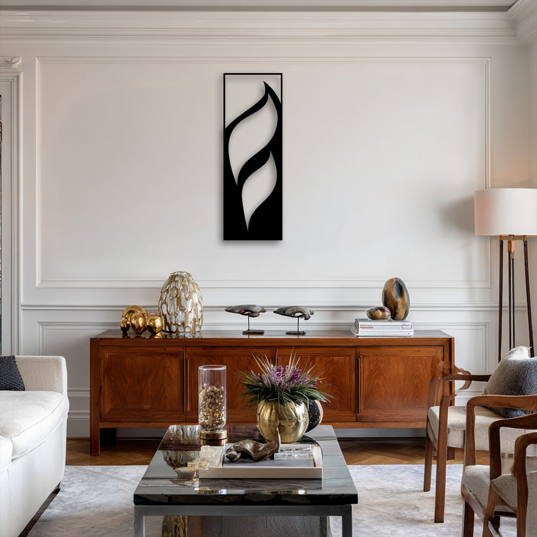 The darkest area is a striking piece of unique metal wall art, featuring abstract flowing leaf silhouettes against a light wall.