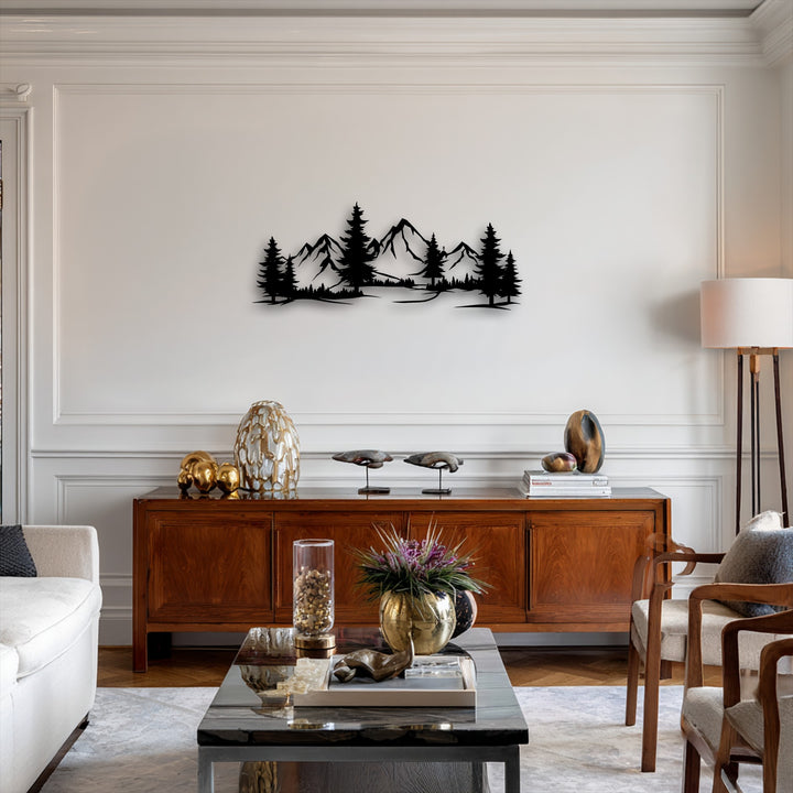 The focal point is a striking black silhouette of mountain and forest landscape, a unique metal wall art piece, dominating the light-colored wall.