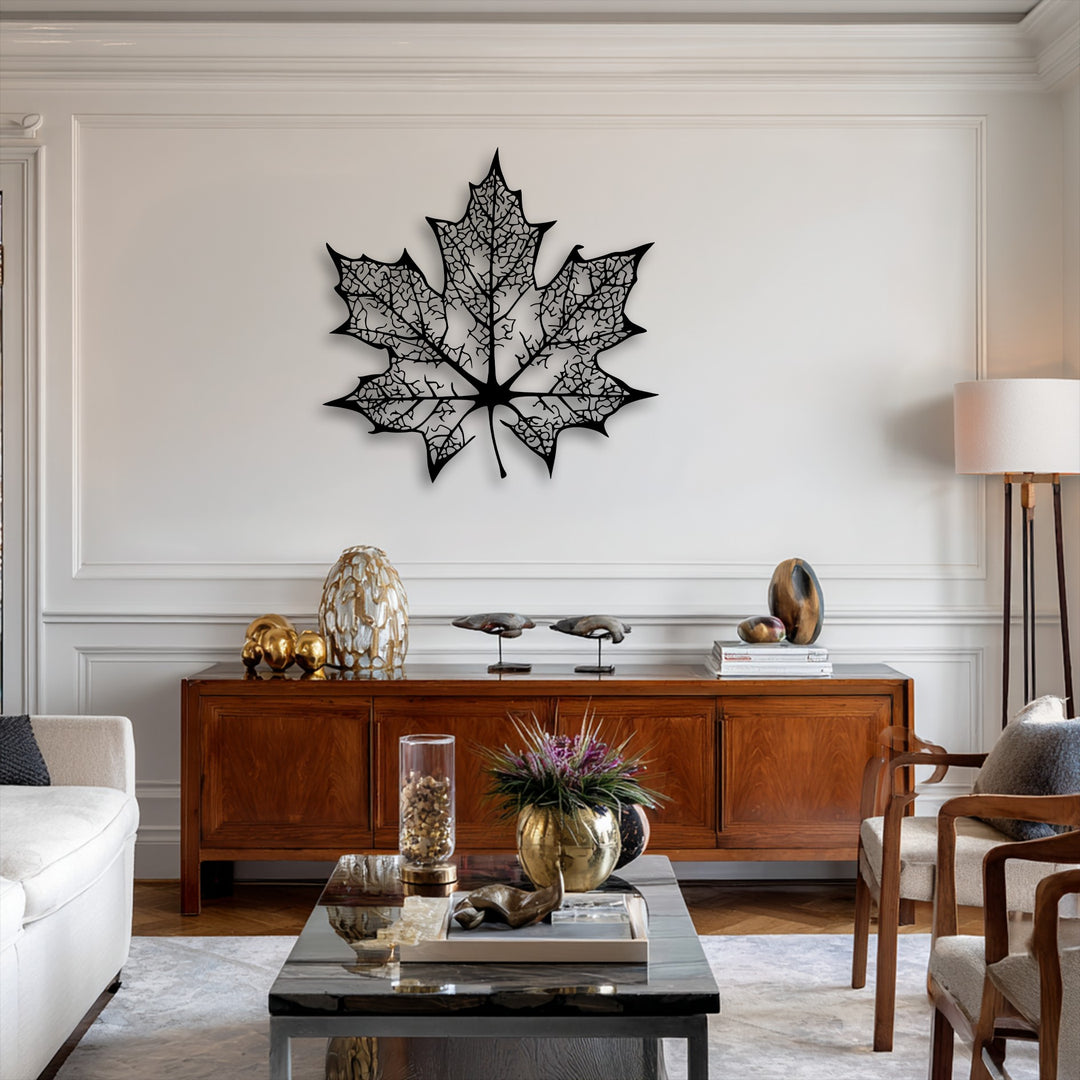The elegant white paneled walls with classic crown molding create a sophisticated background for the metal decoration wall art.