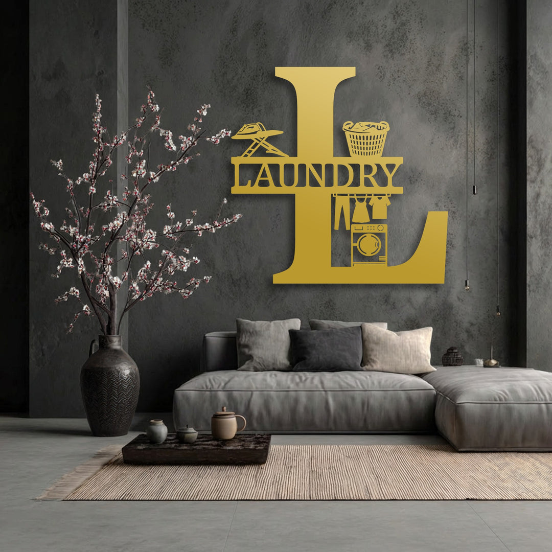 Low color saturation defines this scene, highlighting the vibrant golden personalized laundry room monogram metal artwork against a muted grey wall.