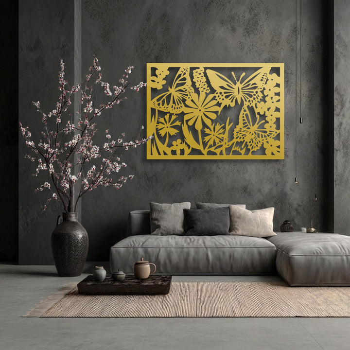 The striking gold butterfly garden, a unique metal wall art piece, is the focal point on a textured dark gray wall above a modern sofa.