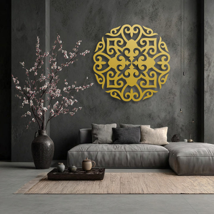 The brightest area highlights a stunning golden ornate floral mandala metal wall decor with intricate symmetrical patterns.