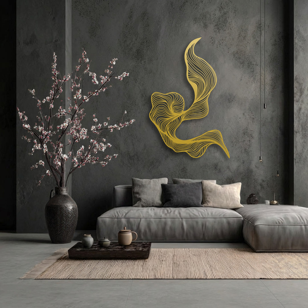 A vibrant, large golden abstract decorative metal art piece with fluid, swirling lines is the striking focal point in a modern dark grey living room.