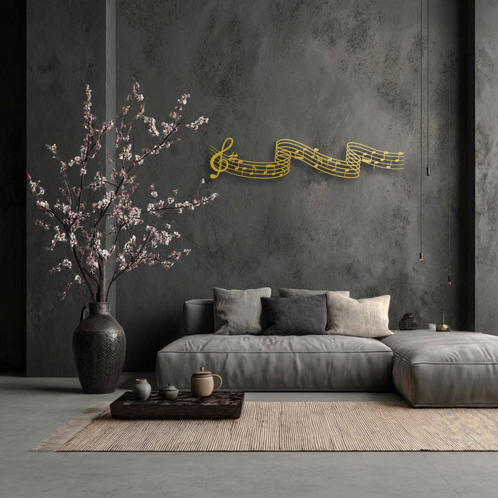 The textured dark grey wall provides a dramatic backdrop for the smooth, intricate lines of the unique metal wall art featuring flowing musical notes.