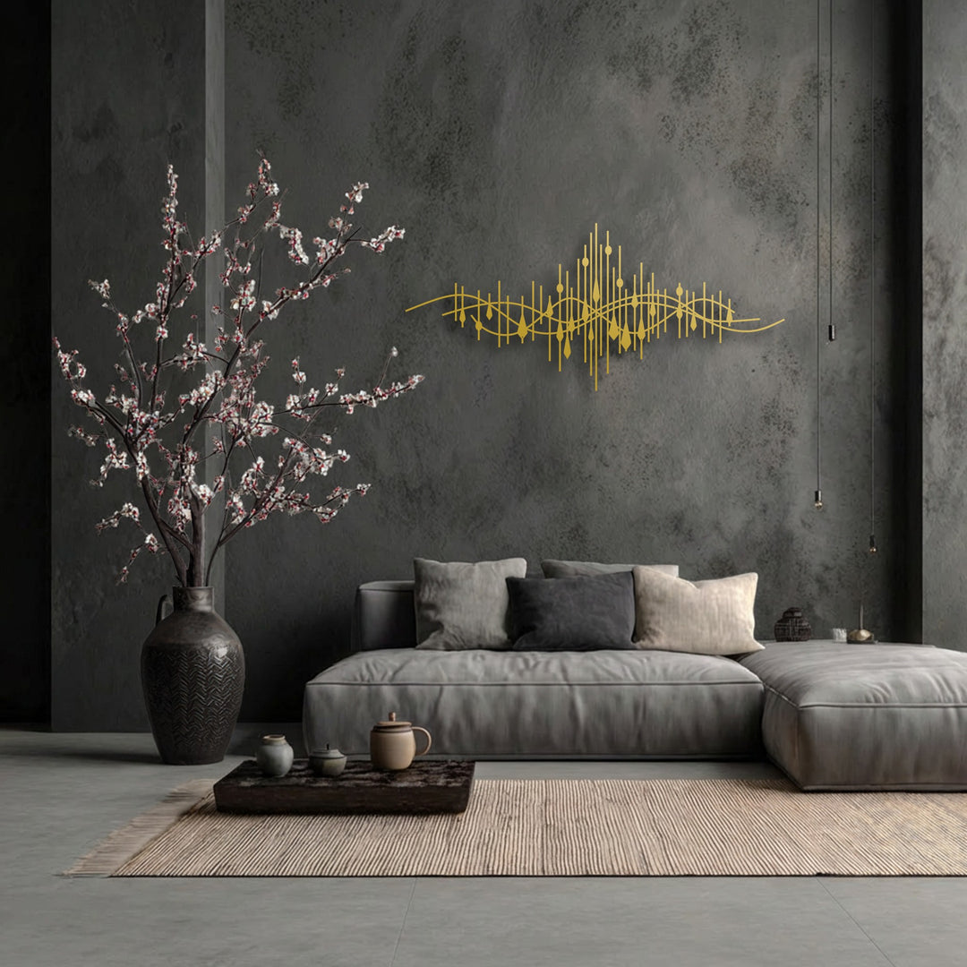 The focal point is an elegant golden abstract soundwave decorative metal art piece, a modern line design centered on a dark grey textured wall.