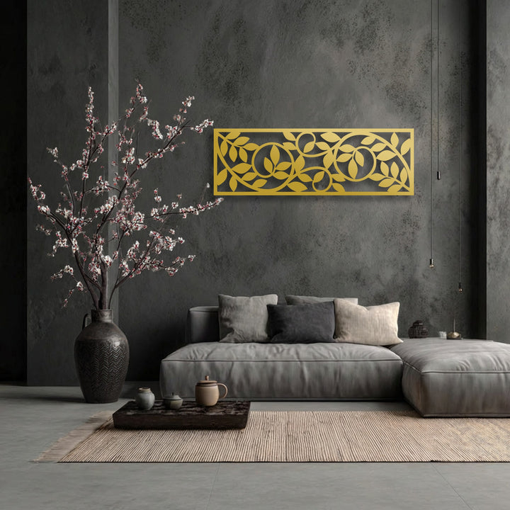 The crisp, defined edge and borders of the gold botanical vine decoration wall art panel stand out against the dark wall.