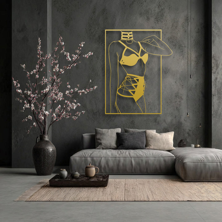 Distressed concrete walls and soft fabric cushions contrast with the smooth, golden Minimalist Female Silhouette metal art for wall, highlighting diverse textures.