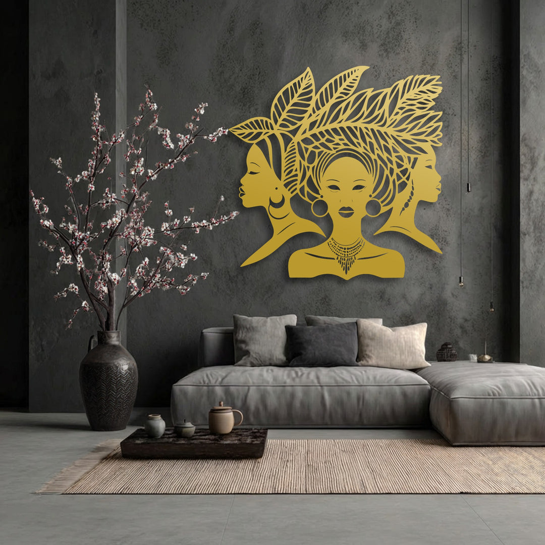Soft light highlights the intricate details of the unique metal wall art featuring African women silhouettes, creating subtle shadows against the dark textured wall.
