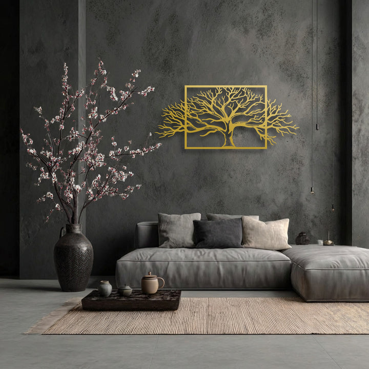 The subtle interplay of light and shadow on the gold framed tree metal wall art creates a captivating decoration wall art against the dark, textured wall.