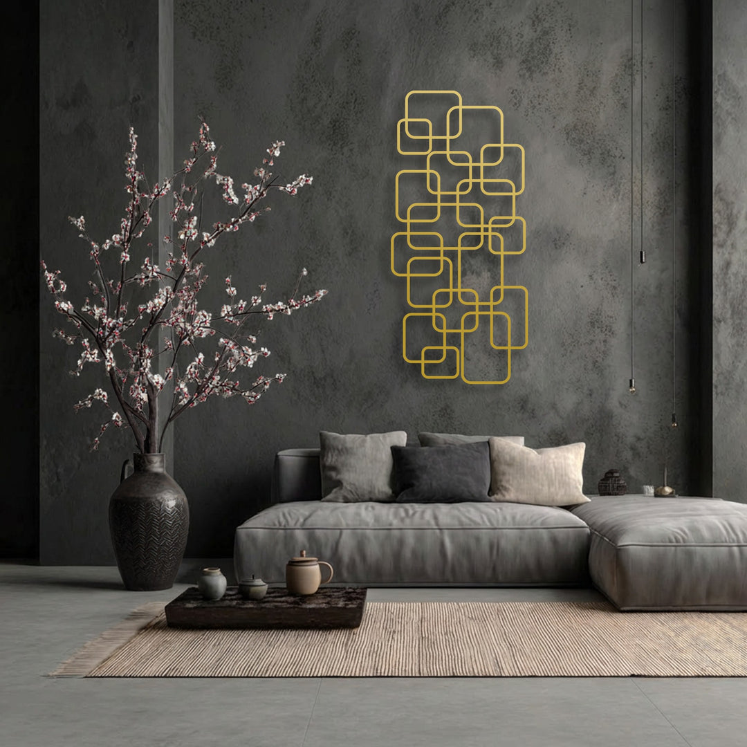 Highlighting the transition from muted greys to vibrant gold, this decorative metal art creates a striking visual contrast in the room.