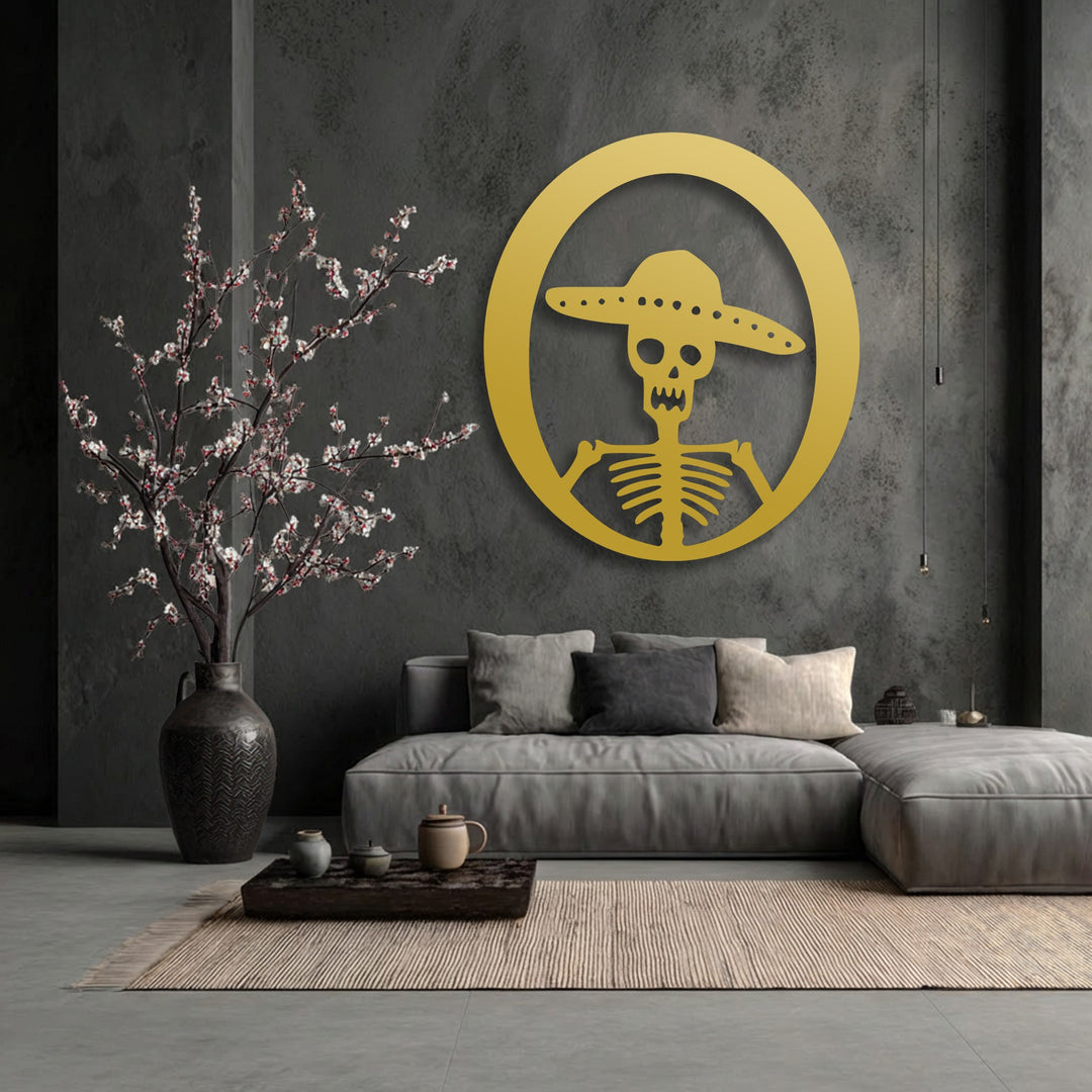 The central subject is a striking gold circular decorative metal art featuring a stylized sombrero skeleton, perfect for Day of the Dead decor.