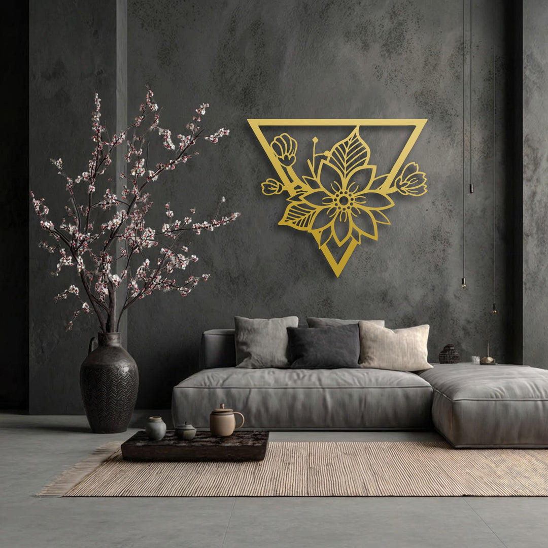 Highlighting its abstract quality, this unique metal wall art presents a golden geometric floral blossom within a modern triangle frame.