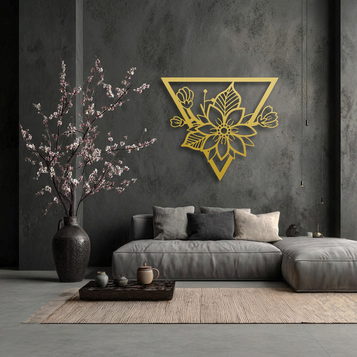 Highlighting its abstract quality, this unique metal wall art presents a golden geometric floral blossom within a modern triangle frame.