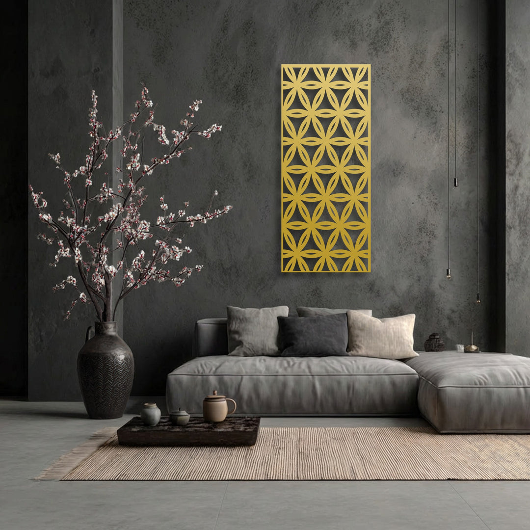 The prominent golden panel features an intricate repeating floral-inspired geometric pattern, enhancing the modern metal wall decor in the space.