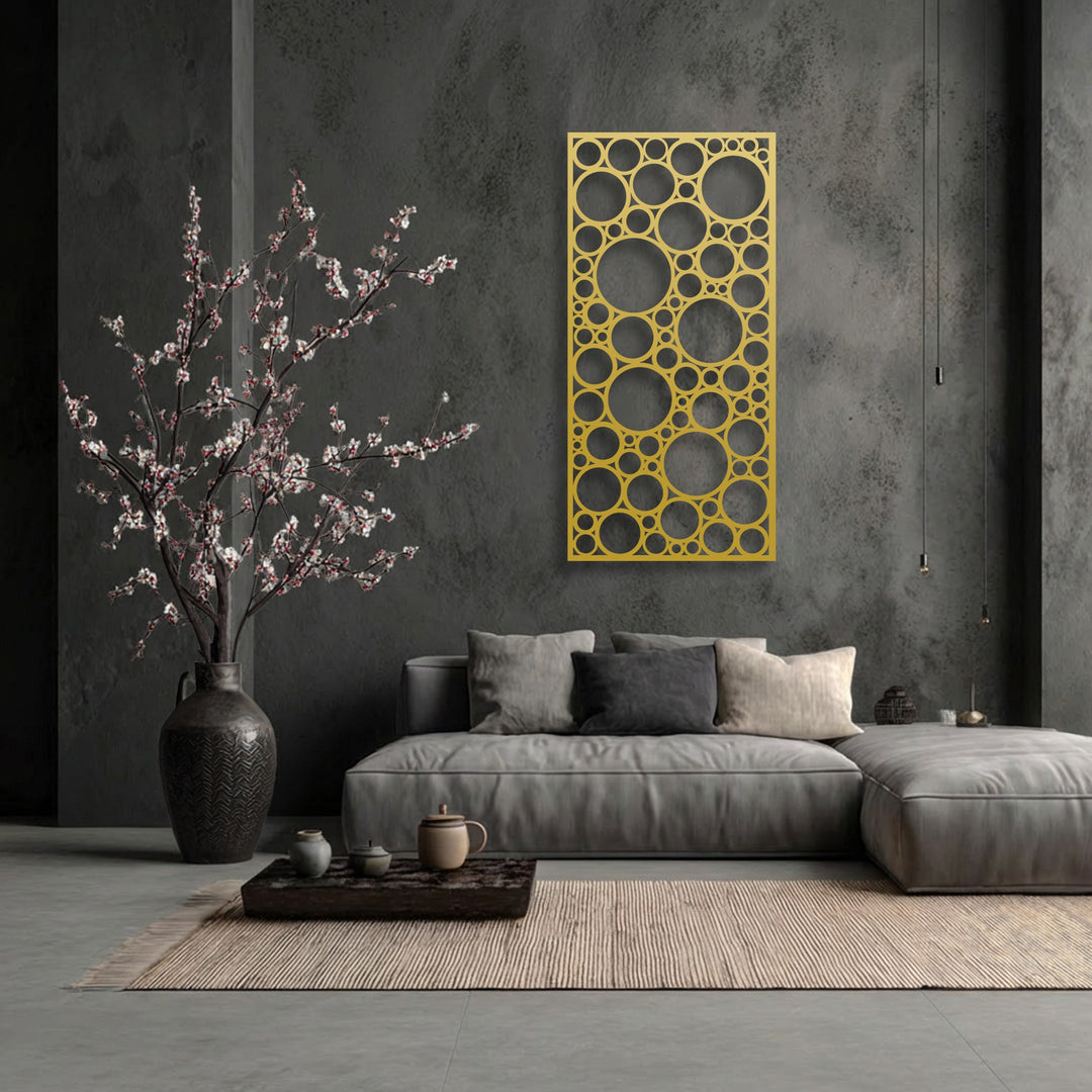 A dark gray, distressed background enhances the intricate geometric circle pattern of the unique metal wall art.