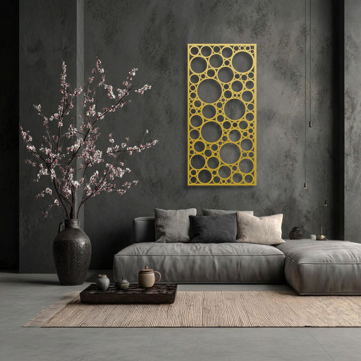 A dark gray, distressed background enhances the intricate geometric circle pattern of the unique metal wall art.