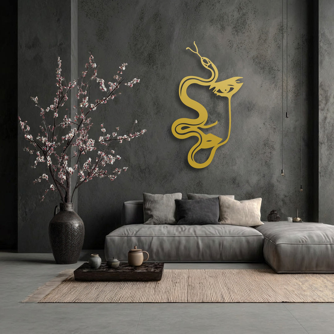 Geometric elements like the flowing lines of the abstract woman and serpent silhouette form a striking gold metal artwork on the textured dark wall.