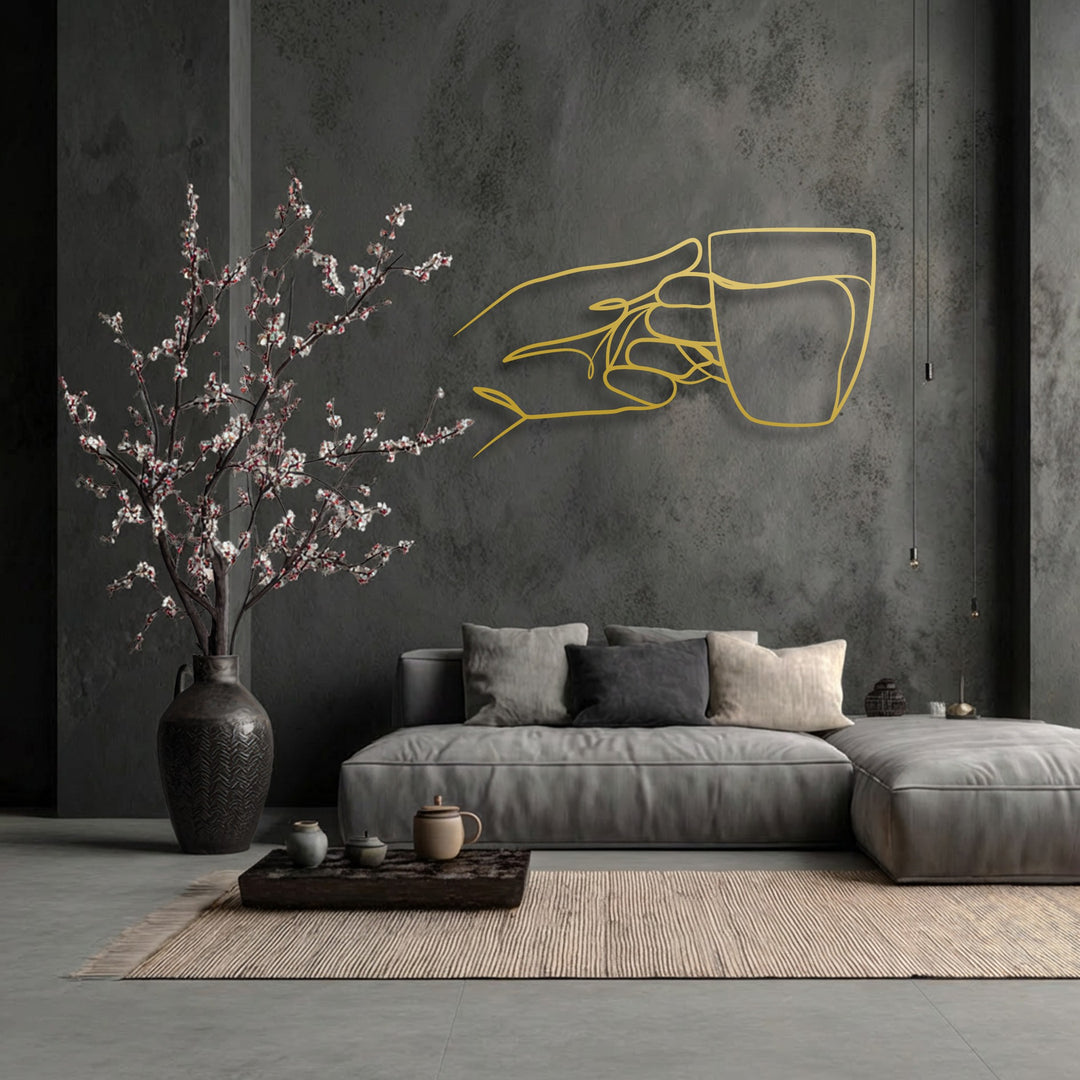 Negative space masterfully defines the minimalist hand holding a cup, an elegant piece of decorative metal art.