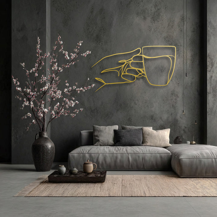 Negative space masterfully defines the minimalist hand holding a cup, an elegant piece of decorative metal art.